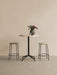 Harbour Column Counter Table with a white marble top and black star base, styled with two Afteroom Counter Stools and a vase.