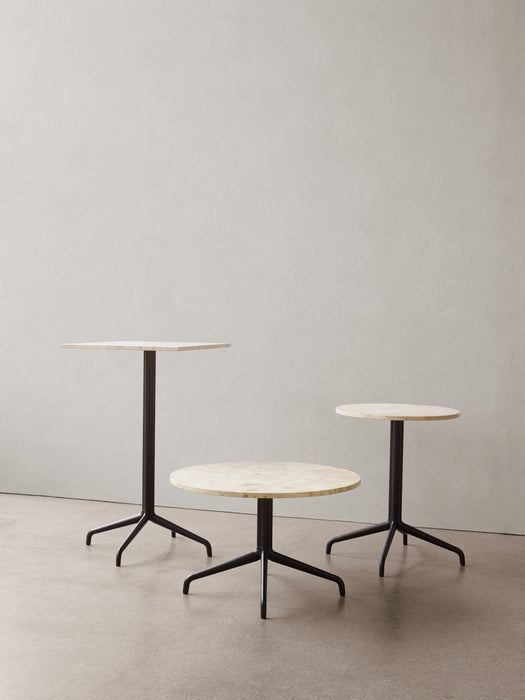Three variations of the Harbour Column Table—Lounge, Dining, and Bar—with light stone tops and black bases in neutral space.