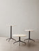Three variations of the Harbour Column Table—Lounge, Dining, and Bar—with light stone tops and black bases in neutral space.