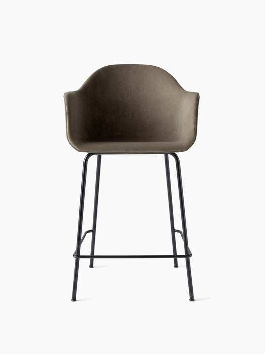 Front view of the Harbour Counter Chair, Upholstered. Features a dark taupe velvet shell and a slender, black steel base.