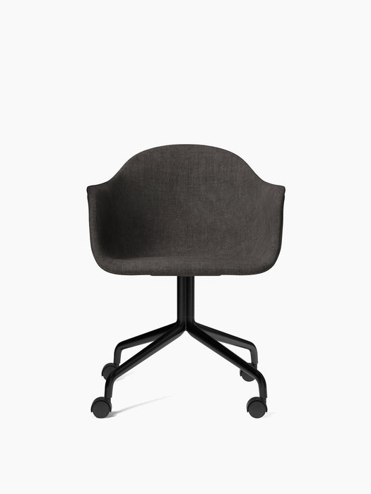 A front view of the Harbour Dining Chair with a dark grey upholstered shell, a black star base, and four black caster wheels.
