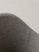 Close-up of the Harbour Lounge Chair showing the textured black and cream woven fabric on the chair's curved backrest.