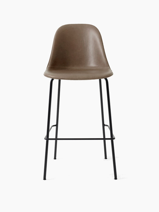 A front view of the Harbour Side Bar Chair upholstered in brown leather, set on a slender, black powder-coated steel frame.