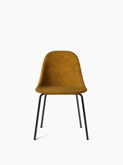 Harbour Side Dining Chair from the front. The seat is upholstered in textured, golden-yellow fabric on a black steel base.