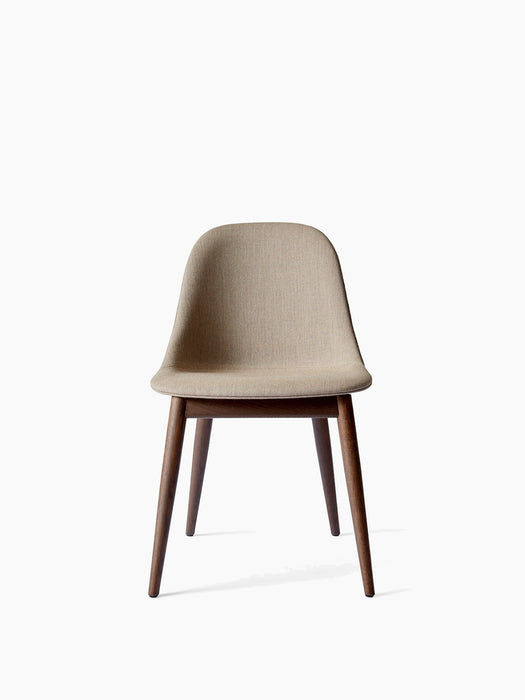 Front view of the Harbour Side Dining Chair with a beige upholstered shell and dark-stained oak legs.