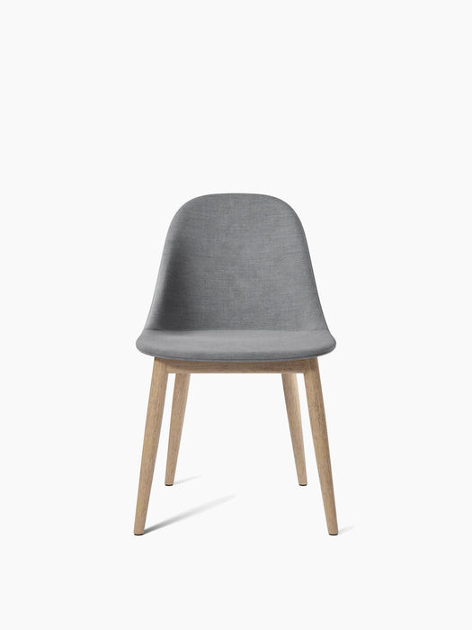 Front view of the Harbour Side Dining Chair with a wooden base, featuring a grey upholstered shell and four natural oak legs.