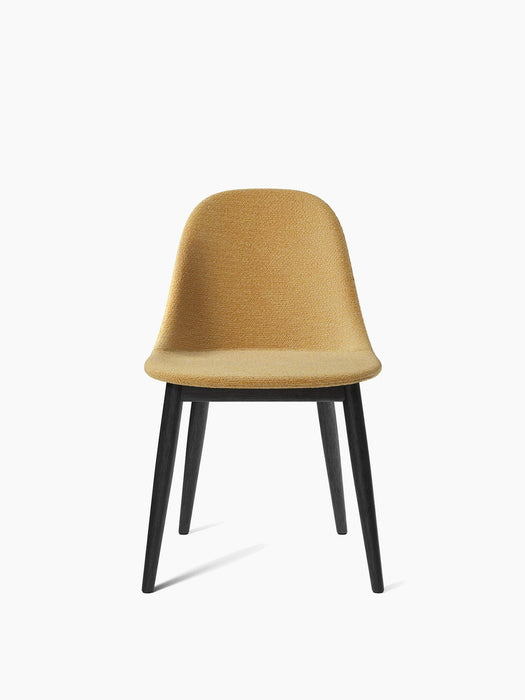 Front view of the Harbour Side Dining Chair with a textured, mustard-yellow upholstered seat on a black oak base.