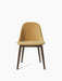A Harbour Side Dining Chair with a wooden base, moss-green upholstered shell and dark stained oak legs.