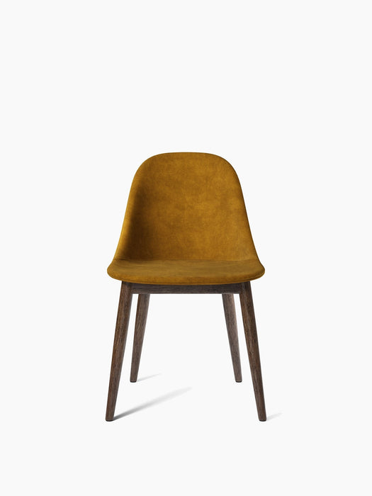 A front view of the Harbour Side Dining Chair, upholstered in mustard yellow Champion fabric with a dark stained oak base.
