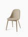 Angled view of the Harbour Side Dining Chair with a light beige bouclé upholstered seat and four natural oak wooden legs.