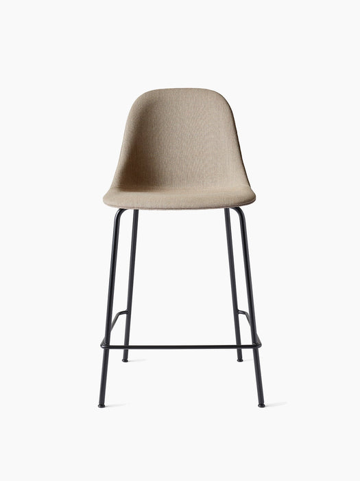 Front view of the upholstered Harbour Side Counter Chair with a light brown fabric seat and slender black steel base.