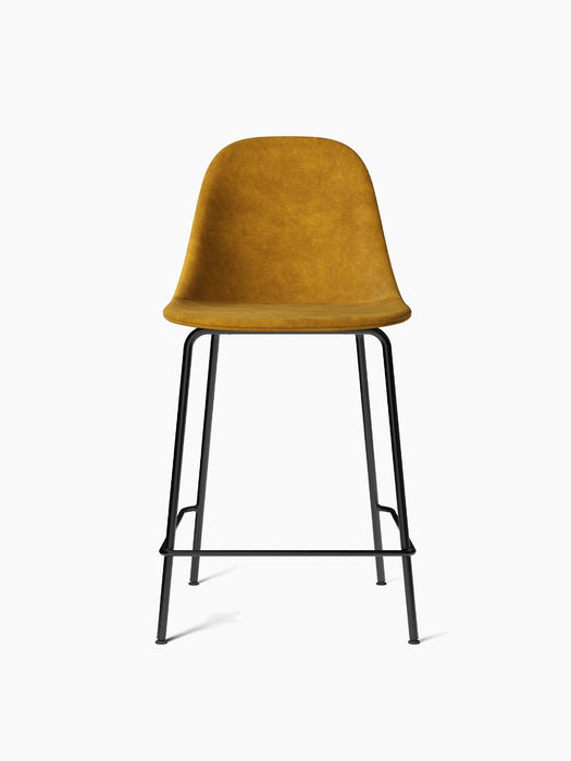 Front view of the Harbour Side Counter Chair, upholstered in a mustard-yellow fabric, with a black powder-coated steel base.