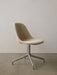 Angled view of the Harbour Side Dining Chair with light, textured upholstery and a polished aluminium star base.