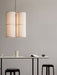 Hashira Pendant Lamp Cluster hangs over a Snaregade Counter Table with Passage Stools, a Yana Brewing Pot, and a magazine.
