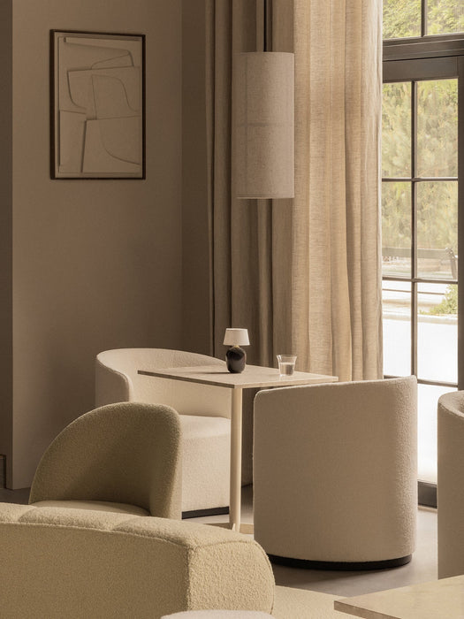 The Hashira Pendant Lamp hangs over a Nook Dining Table, surrounded by Tearoom Chairs, in a serene, neutral-toned room.
