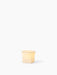 The small, square-shaped Ignus Flameless Candle (H8) made of bone china, glowing with a warm light on a white background.