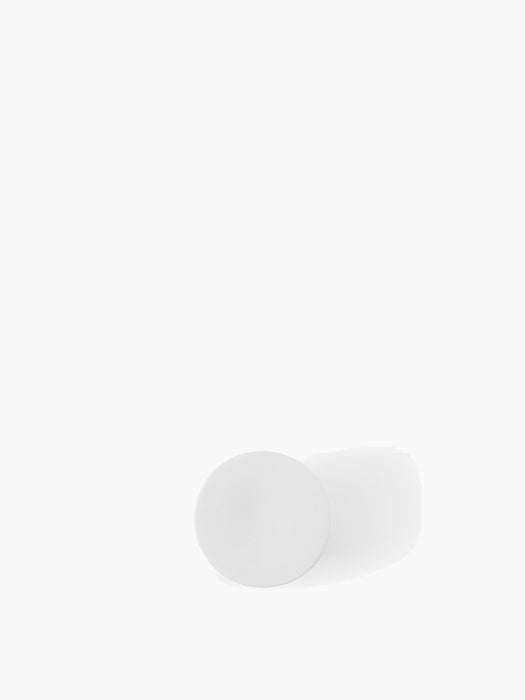 A top-down photograph of the Ignus Flameless Candle, showing its circular, white, matte surface against a white background.