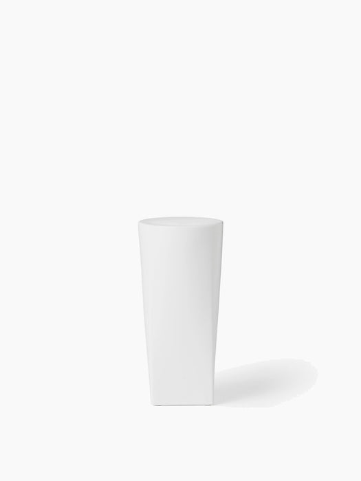 Front view of the Ignus Flameless Candle, a tall, sculptural white candle in matte bone china, on a white background.