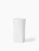 A tall, sculptural Ignus Flameless Candle in matte white bone china, with a square base and round top, on a white background.