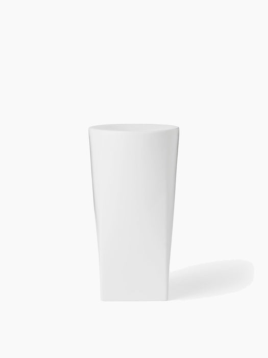 A front-on studio shot of the tall, sculptural Ignus Flameless Candle in matte white, set against a plain white background.