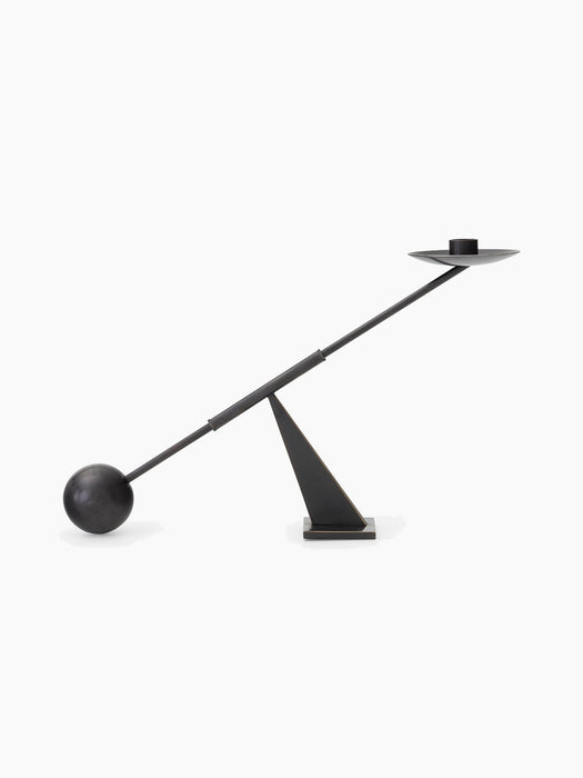 Audo Balance Candle Holder in bronzed brass, a sculptural piece with a pivoting arm balanced by a sphere and candle holder.
