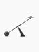 Audo Balance Candle Holder in bronzed brass, a sculptural piece with a pivoting arm balanced by a sphere and candle holder.