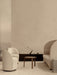 Beige room with Tearoom Sofa and Chairs, Passage Lounge Table, Volume Side Table, and black Interconnect Candle Holder.