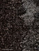 A detailed close-up of the dark brown, curly Sheepskin Root textile, an upholstery option for the Knitting Lounge Chair.