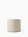 Back view of the cylindrical Tearoom Lounge Chair, upholstered in a light beige Logan Jasmin fabric on a white background.