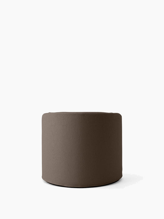 A cylindrical Tearoom Pouf upholstered in a textured, dark brown Logan Flint fabric, shown against a plain white background.