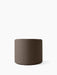 A cylindrical Tearoom Pouf upholstered in a textured, dark brown Logan Flint fabric, shown against a plain white background.