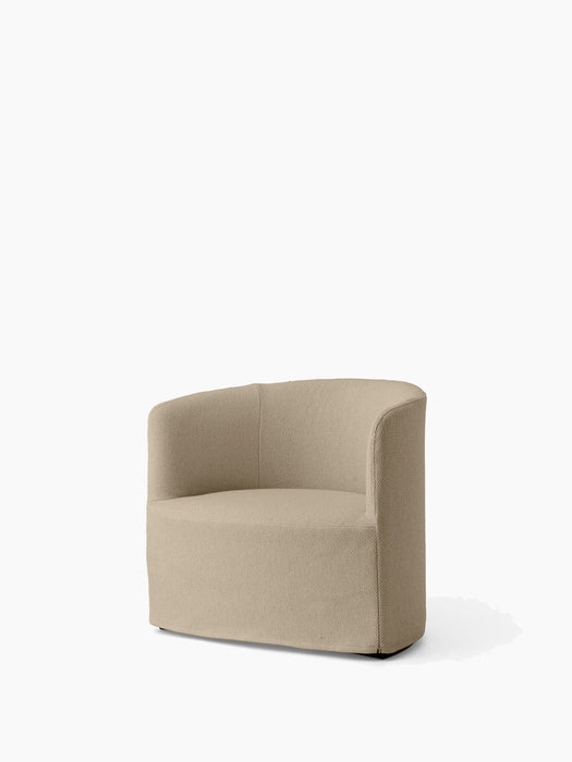 Angled view of the Tearoom Lounge Chair, upholstered in a textured, light beige Logan Sand fabric against a white background.