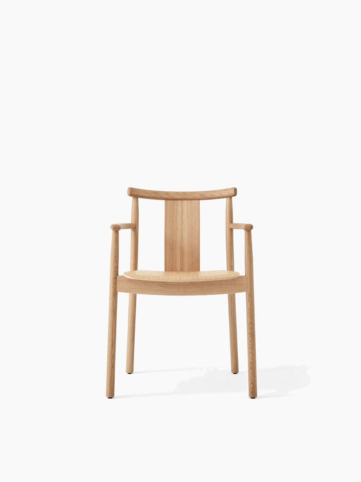 Front view of the wooden Merkur Dining Chair with Armrests in natural oak, featuring a curved backrest and solid wood seat.