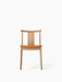 Front view of the Merkur Dining Chair, shown with a natural oak frame and an upholstered seat in warm tan Dakar leather.