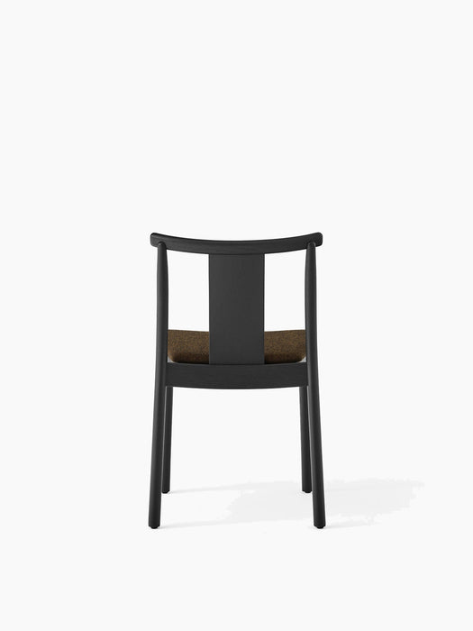 Back view of the Merkur Dining Chair in black oak with a brown Hallingdal 370 upholstered seat against a white background.