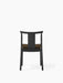Back view of the Merkur Dining Chair in black oak with a brown Hallingdal 370 upholstered seat against a white background.