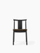 Front view of the Merkur Dining Chair, with a black stained oak frame and a dark brown upholstered seat.