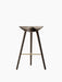 Front view of the sculptural, three-legged ML 42 Bar Stool in smoked oak with a brass footrest on a white background.