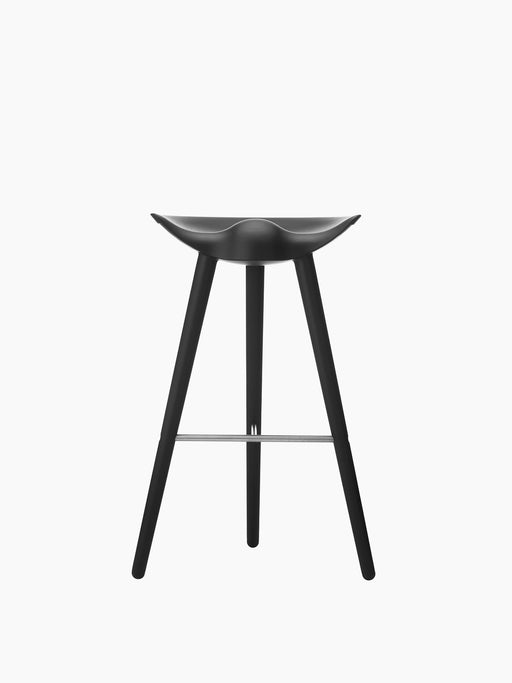ML 42 Bar Stool in black stained beech. The sculptural stool features a moulded seat, three legs, and a steel footrest.