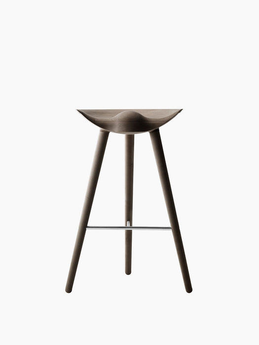 Front view of the ML 42 Counter Stool in smoked oak, with a sculpted seat, three legs, and a stainless steel footrest.