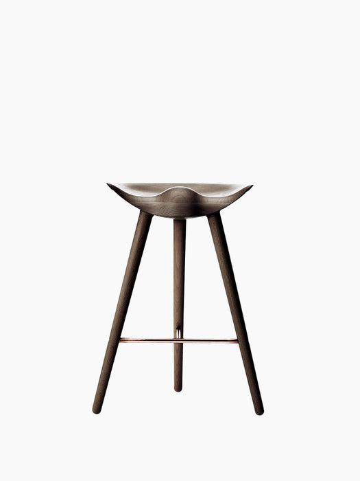 Front view of the ML 42 Counter Stool in brown oiled oak. The stool has a sculpted seat, three legs, and a copper footrest.