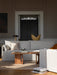 A light grey Eave Modular Sofa in a living room with a wooden Passage Lounge Table. Sunlight streams across a striped rug.