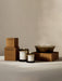 A collection of lit Olfacte Scented Candles from Audo CPH, including two glass jar candles and a large multi-wick bowl.