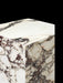 Close-up detail of the corner of the Tall Plinth in Rose marble, highlighting the intricate deep red and purple veining.