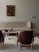 Living room with beige Radiohus Sofa, two Elizabeth Lounge Chairs, marble Androgyne Lounge Table, and Wing Floor Lamp.