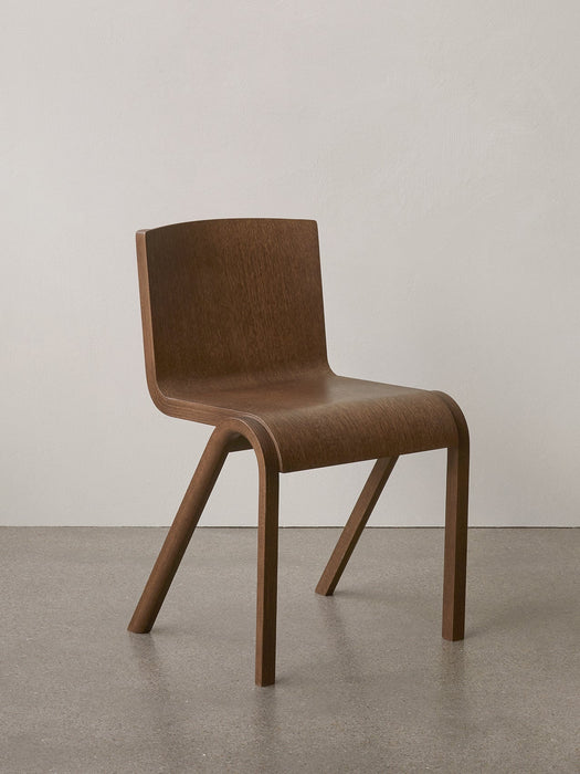 The Ready Dining Chair in natural oak veneer, featuring a curved, cantilevered seat and back, against a neutral backdrop.
