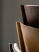 A close-up of the Ready Dining Chair's backrest corner, showing natural oak veneer and layered, form-pressed wood joinery.