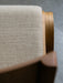 Close-up of the Ready Dining Chair with upholstered seat, showing the texture of the beige fabric and the natural oak frame.