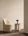 A cream Tearoom Club Chair, Androgyne Side Table, and a portable Reverse Table Lamp in a serene, minimalist setting.