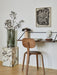 A styled corner with a Rail Desk, an Afteroom Chair, and a marble Plinth. The Reverse Table Lamp sits on the desk.
